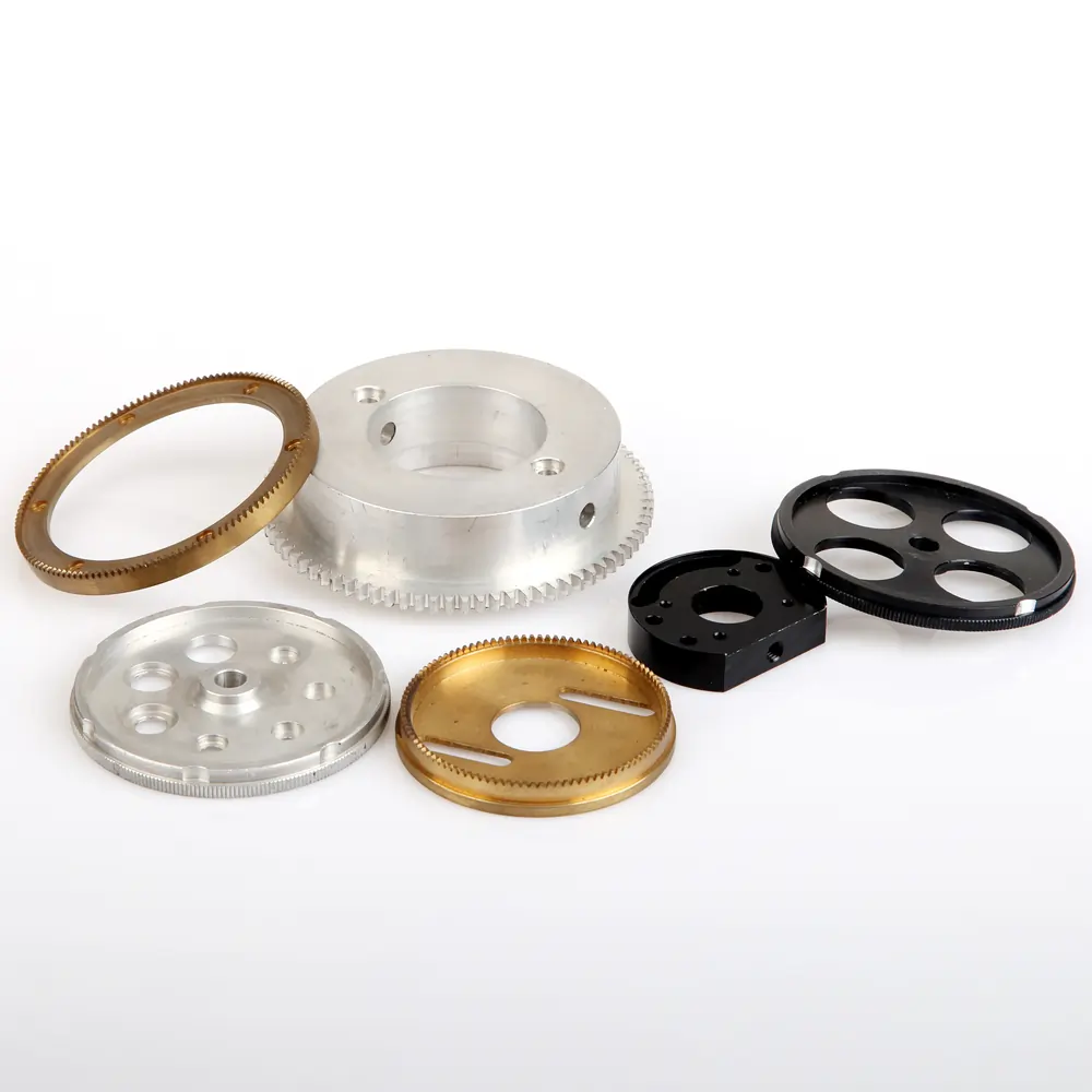 Precision CNC milled gear wheels and turned cylinders in steel and brass