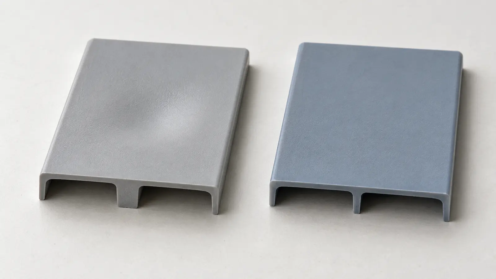 Two molded plastic test coupons viewed from above compare a heavy rib with a slimmer support rib and the surface opposite each feature